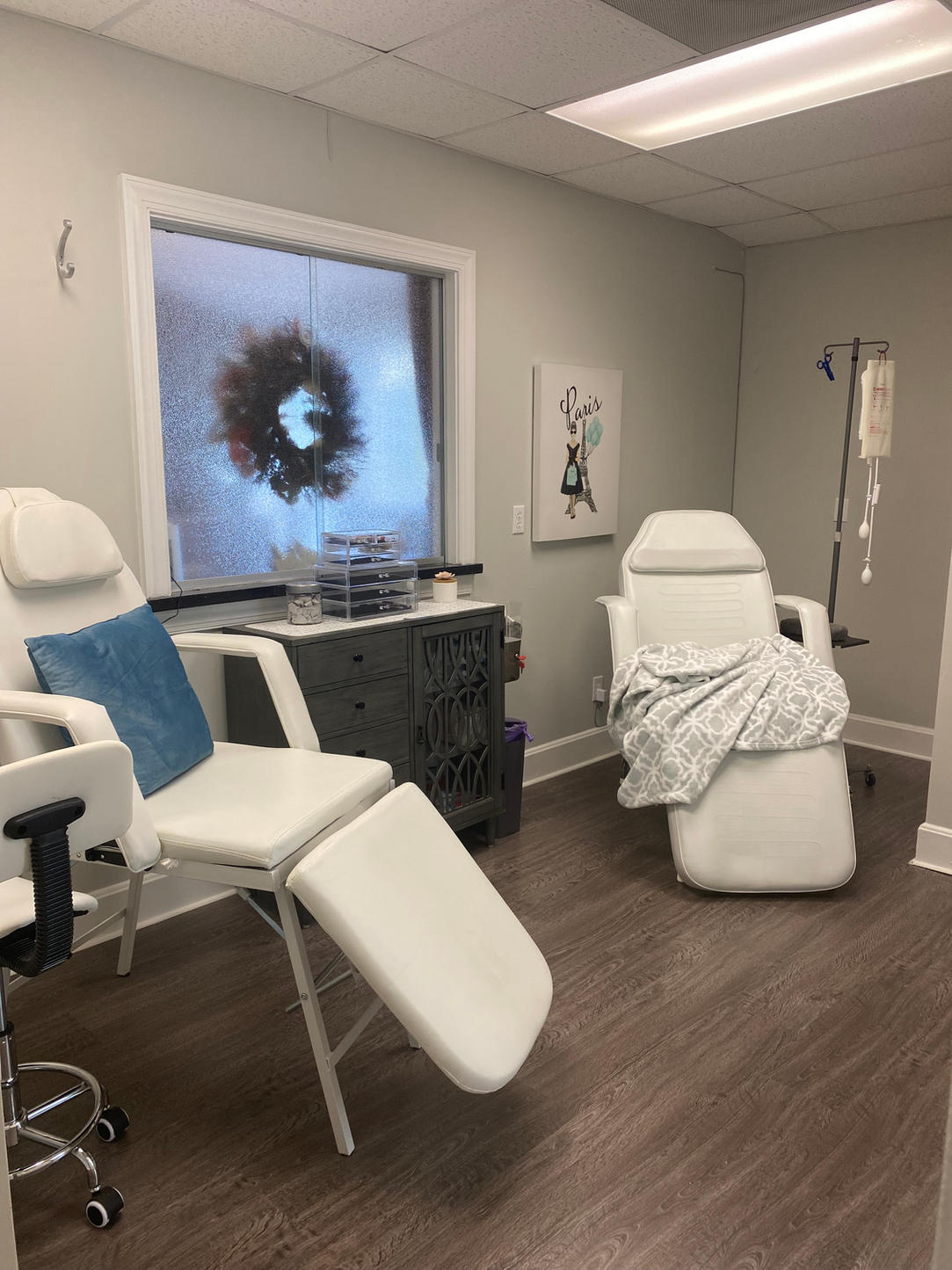 Treatment room with IV chair and infusion pole